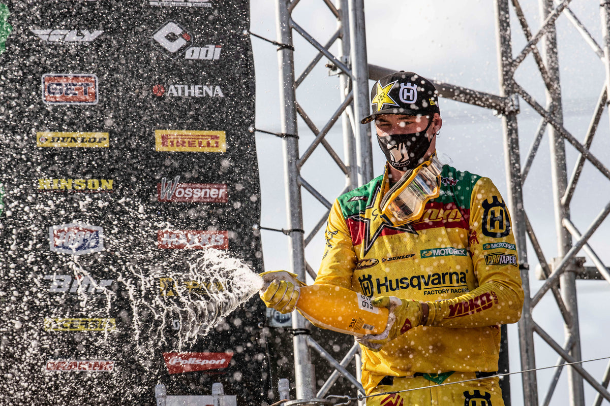 A motocross rider celebrating in Kegums